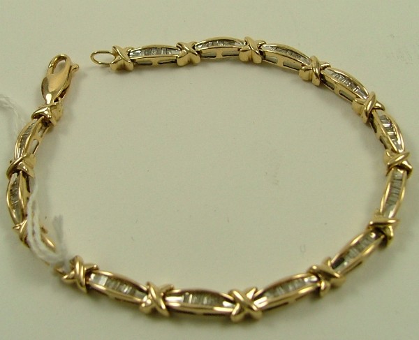 Appraisal: DIAMOND AND TEN KARAT GOLD BRACELET - in length and