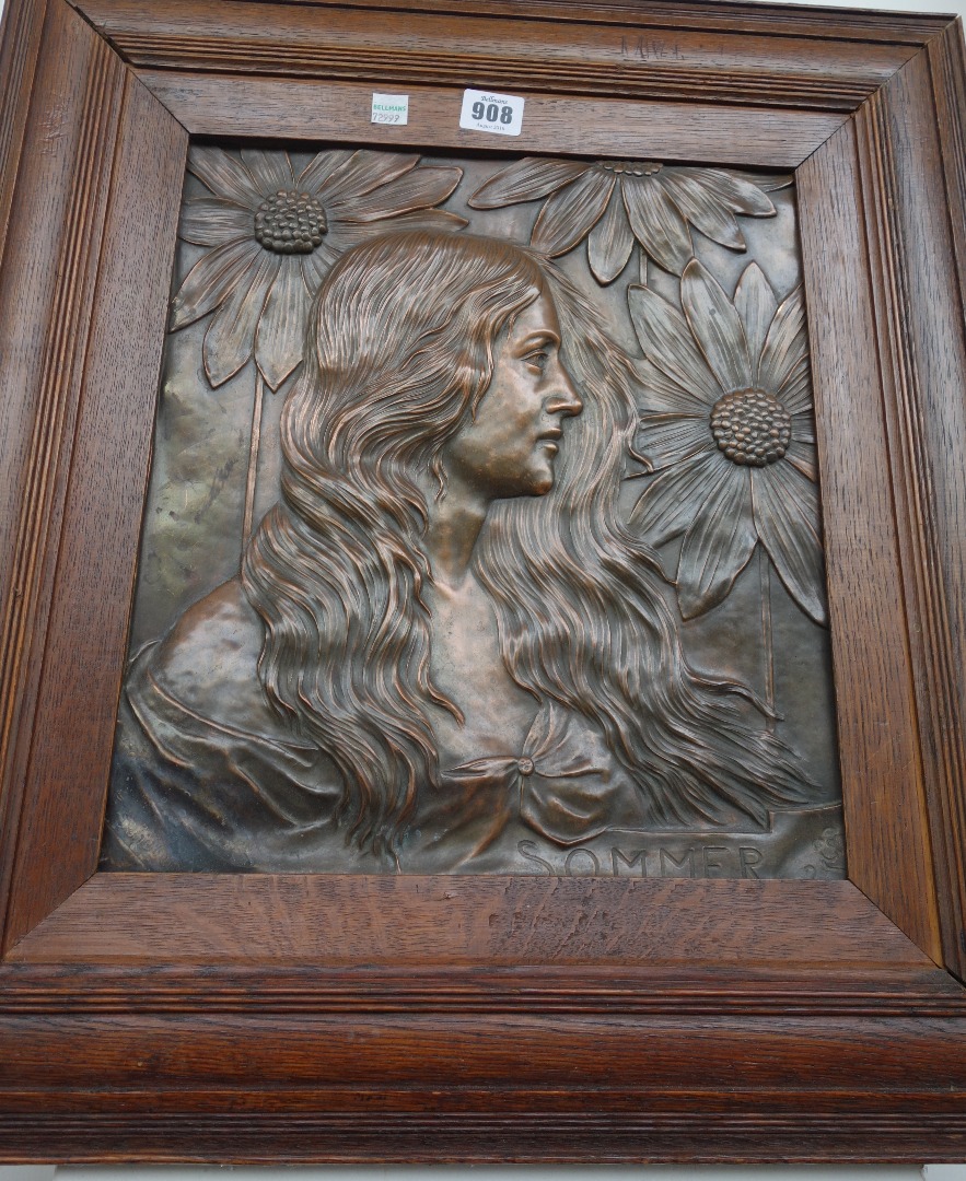 Appraisal: A German patinated copper plaque depicting 'Sommer' in an oak