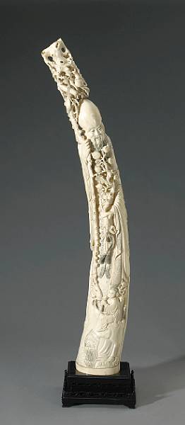 Appraisal: A fine Chinese carved and tinted ivory figure of Shoulao