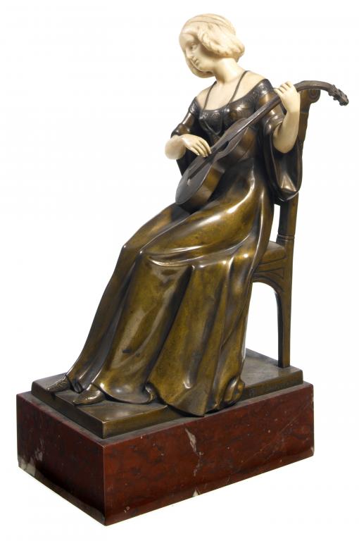 Appraisal: A VIENNESE BRONZE AND IVORY STATUETTE OF A MUSICIAN AFTER