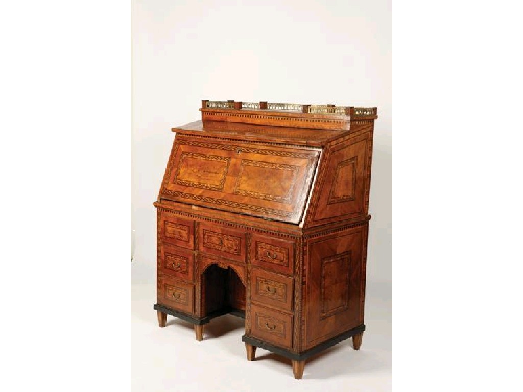 Appraisal: A CONTINENTAL WALNUT AND MARQUETRY BUREAU the sloped front with