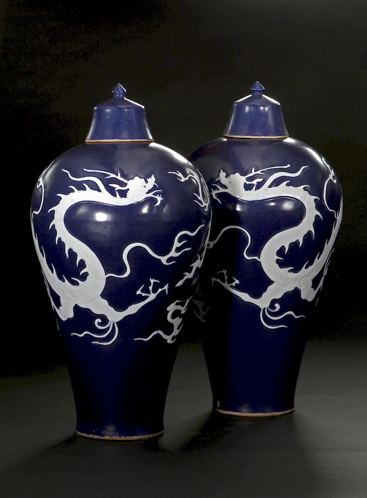 Appraisal: Pair Blue Enameled White Reserved Dragon Vases Each of tall