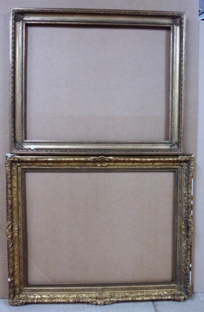 Appraisal: Two th century gilt plaster moulded frames the larger aperture