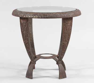 Appraisal: A Seville Studios Cast Iron Table Small circular table in