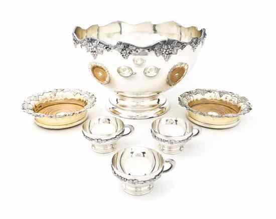 Appraisal: An American Silverplate Punch Bowl Set the footed bowl with