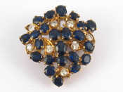 Appraisal: A yellow metal tests carat gold sapphire and diamond brooch