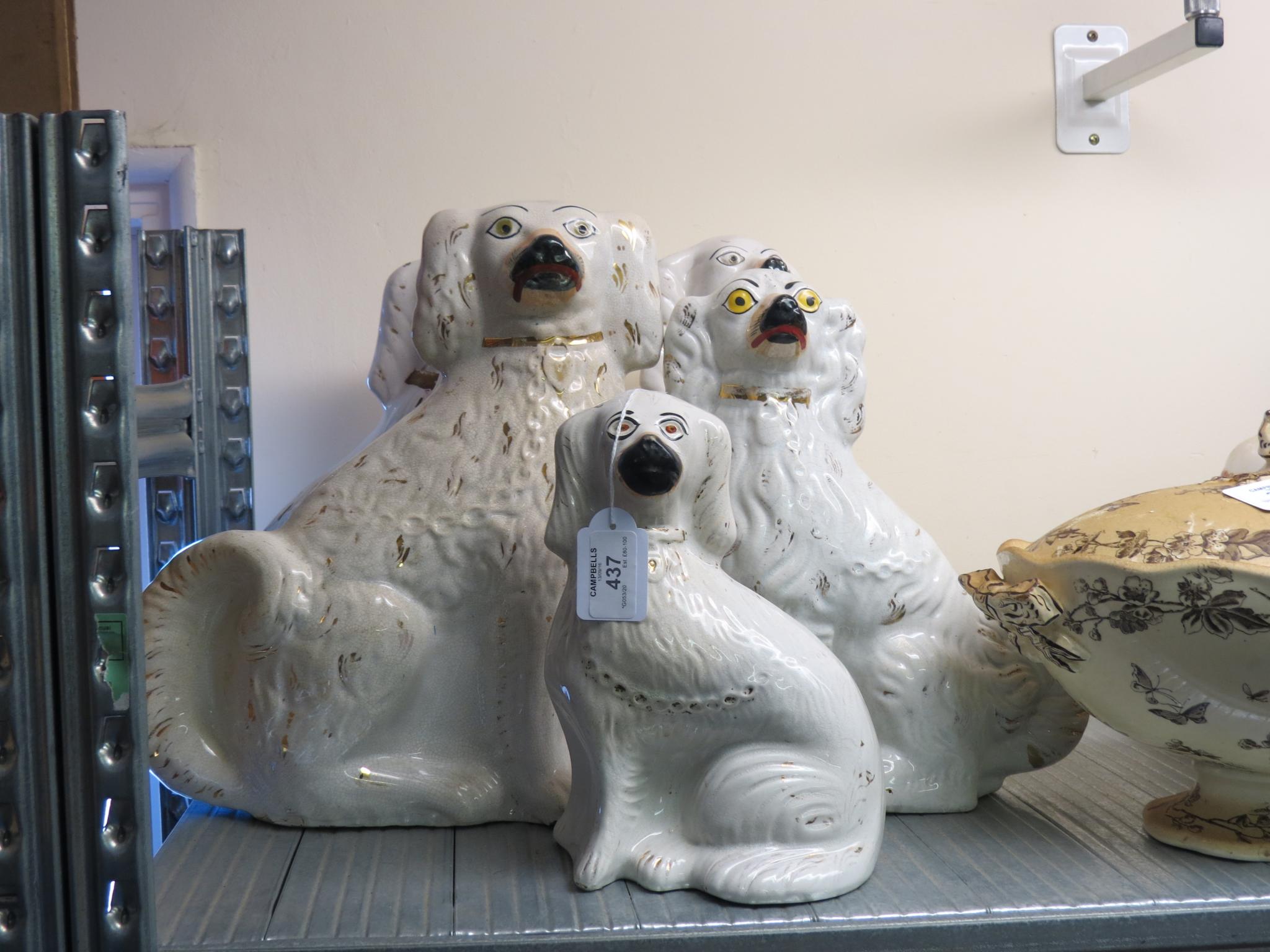 Appraisal: A pair of Victorian Staffordshire comforter spaniels in and three