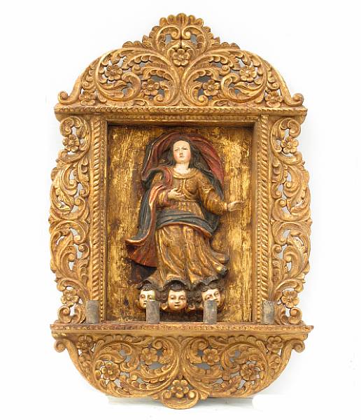 Appraisal: A Spanish Colonial carved giltwood and polychrome decorated retablo height