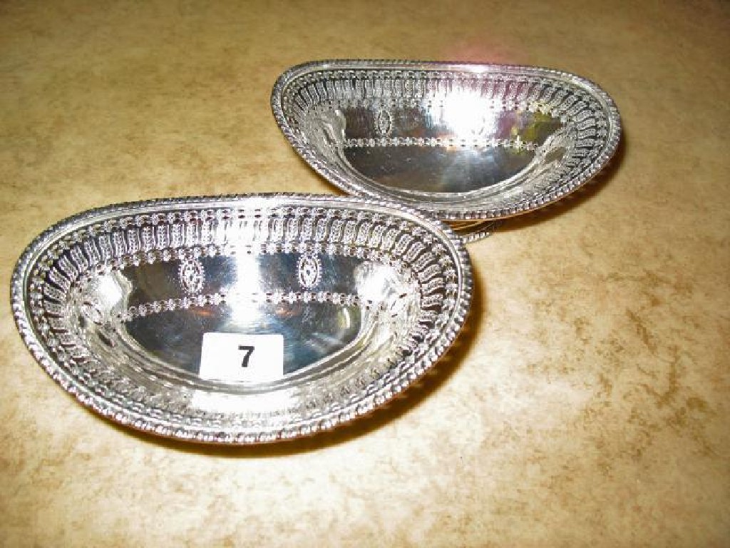 Appraisal: A PAIR OF GEORGE III SWEATMEAT DISHES of oval form