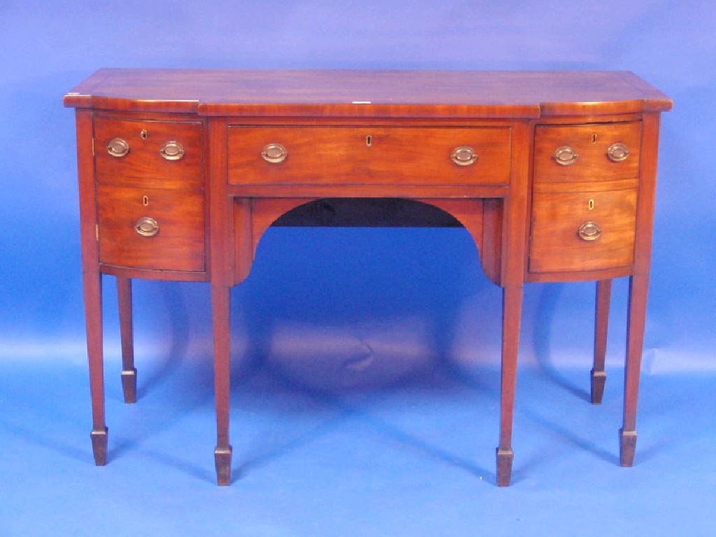 Appraisal: A small George III mahogany breakfront sideboard with a centre