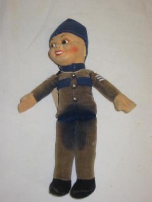 Appraisal: A Norah Wellings policeman doll with painted face blue velvet