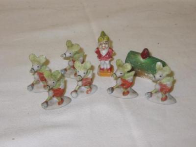 Appraisal: A collection of eight Disney pre-war bisque cake decorations comprising