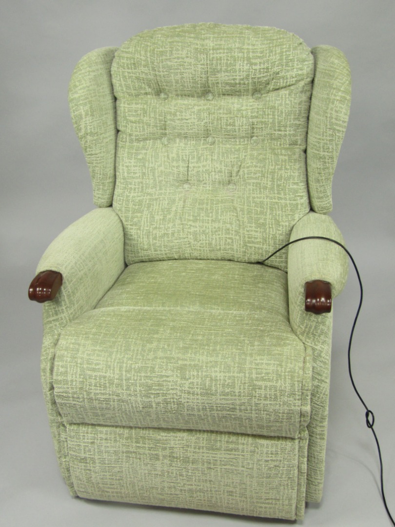 Appraisal: A Sherborne electric recliner armchair upholstered in green and cream