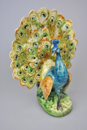 Appraisal: A Continental majolica vase formed as a displaying peacock