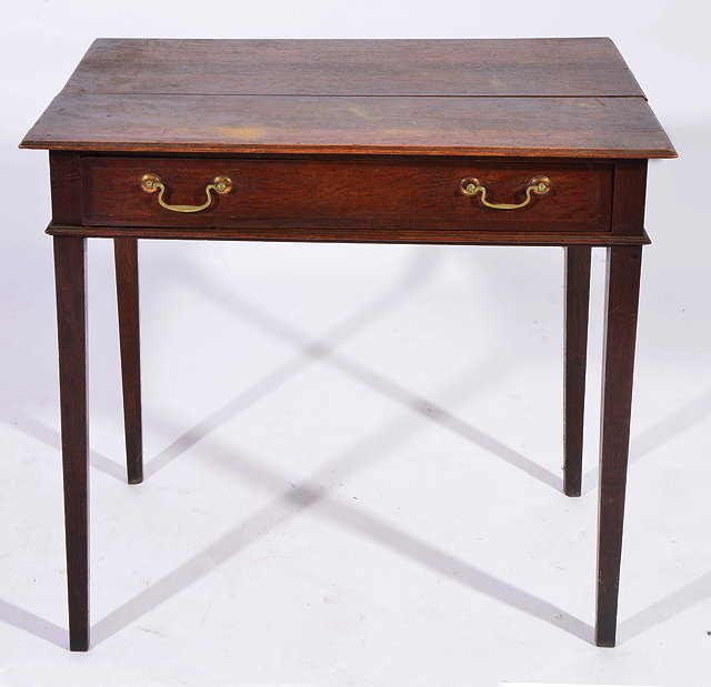 Appraisal: A GEORGE III OAK SIDE TABLE with single frieze drawer