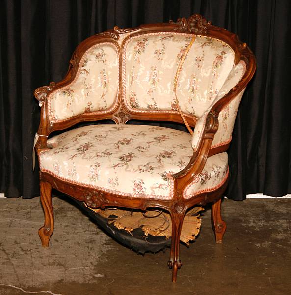 Appraisal: A pair of Rococo style walnut bergeres early th century