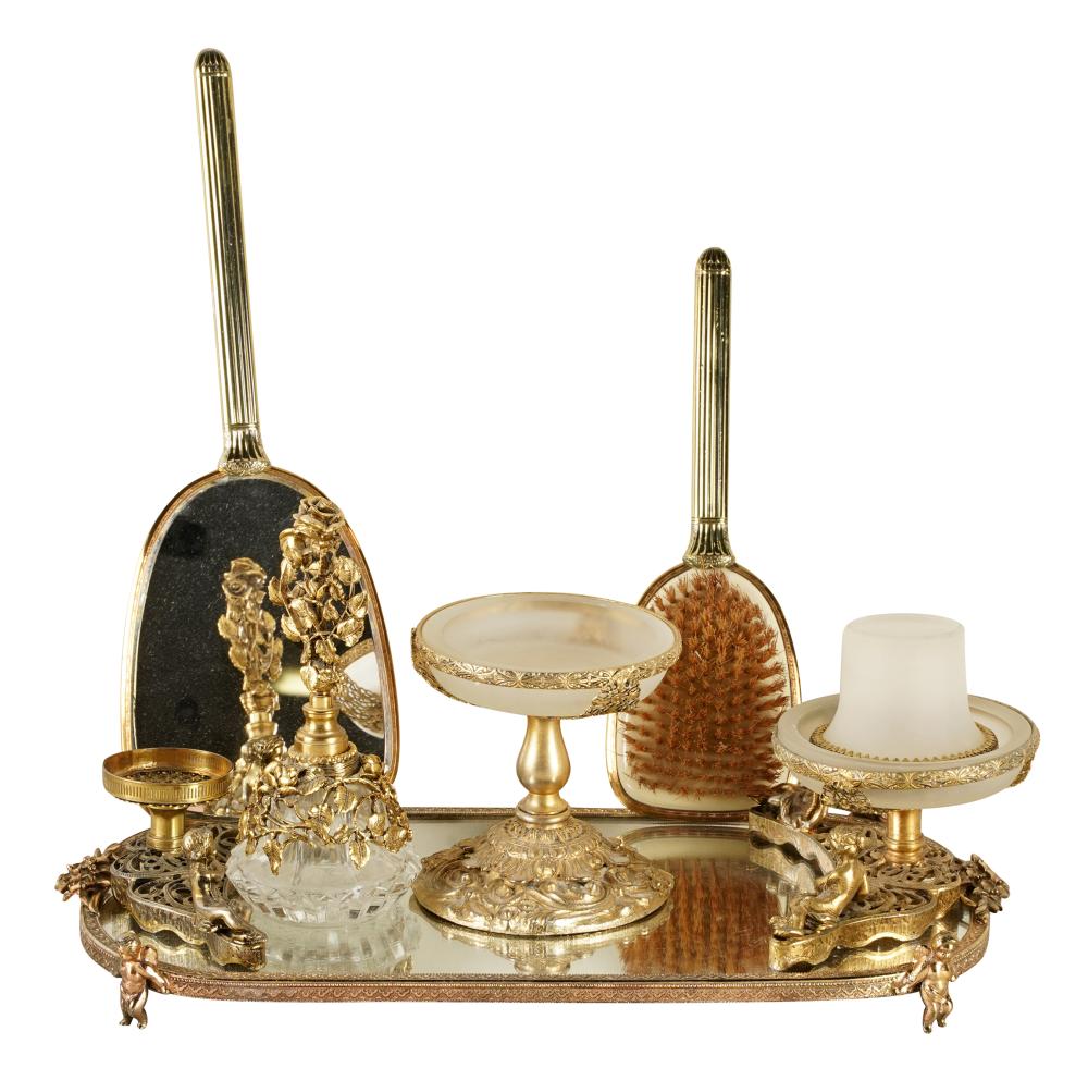 Appraisal: GILT METAL-MOUNTED DRESSER SETcomprising one tray inches wide inches deep