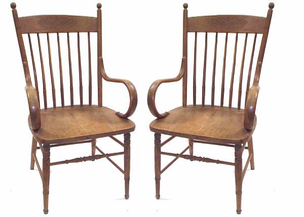 Appraisal: A set of six American oak dining chairs losses to