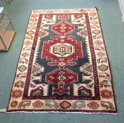 Appraisal: An Ardabil rug the grey ground with red central medallion