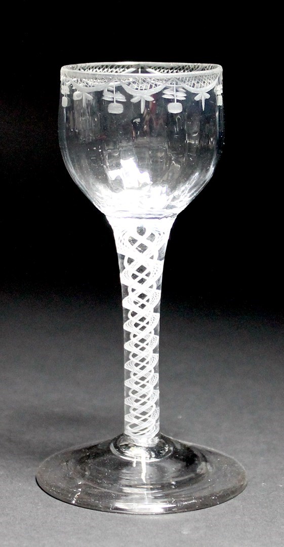 Appraisal: An opaque twist wine glass circa the ovoid bowl moulded