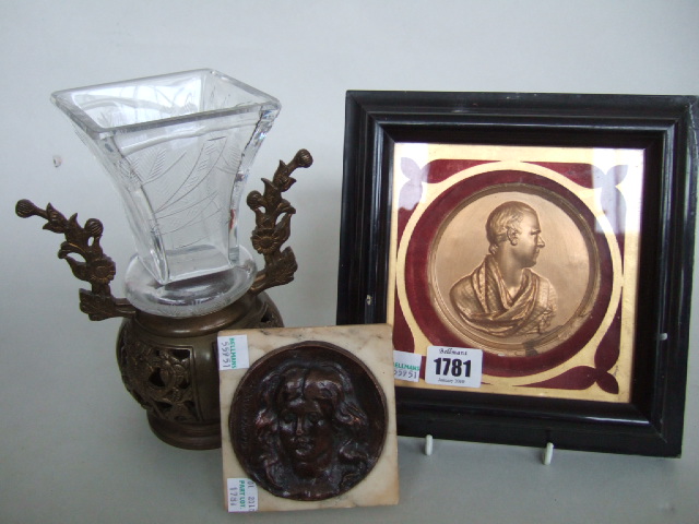 Appraisal: A circular bronze plaque relief moulded with portrait of a