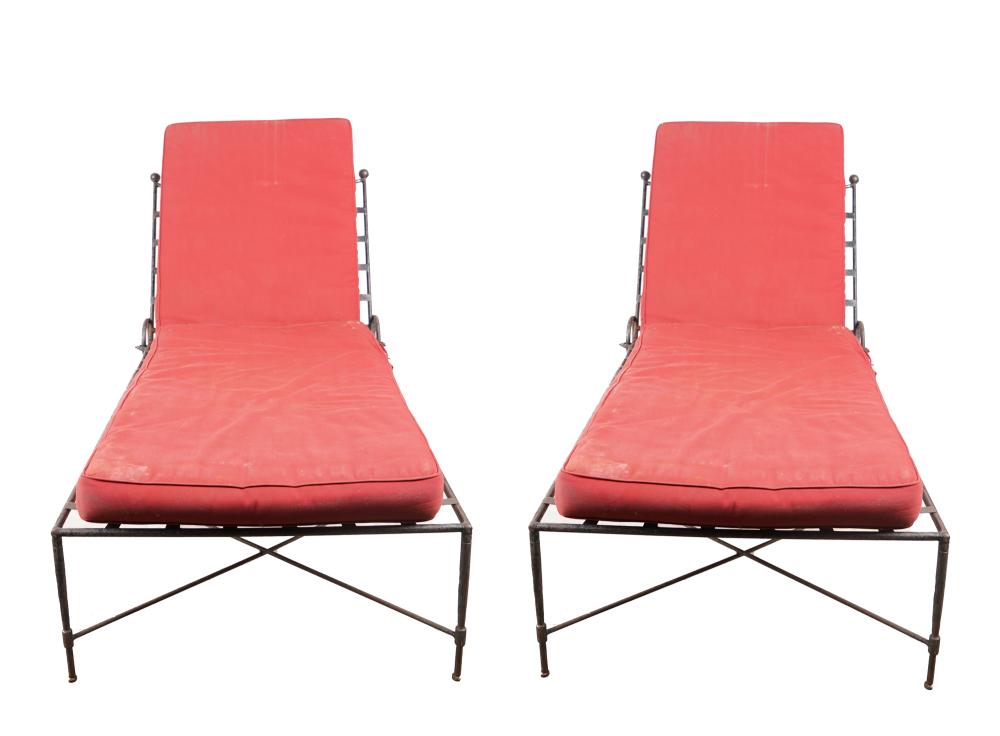 Appraisal: PAIR OF IRON PATIO CHAISE LOUNGESProvenance A Michael Smith installation