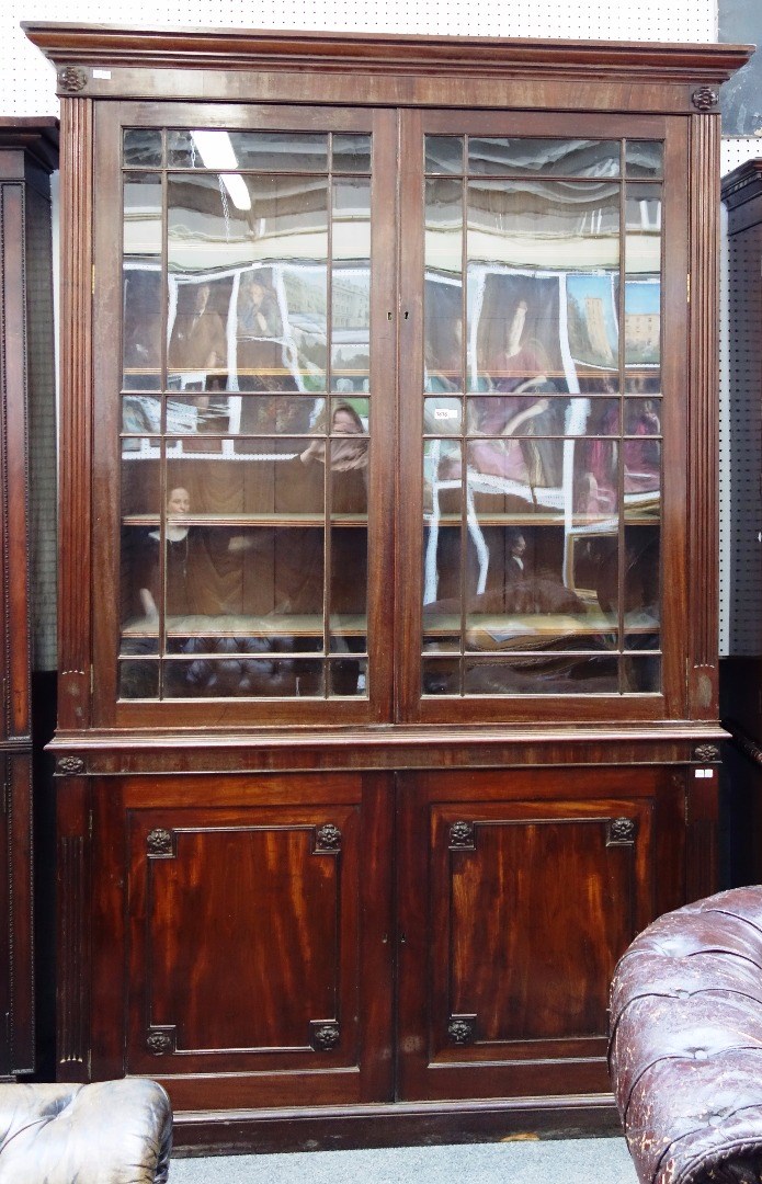 Appraisal: A George III mahogany bookcase cabinet the pair of astragal