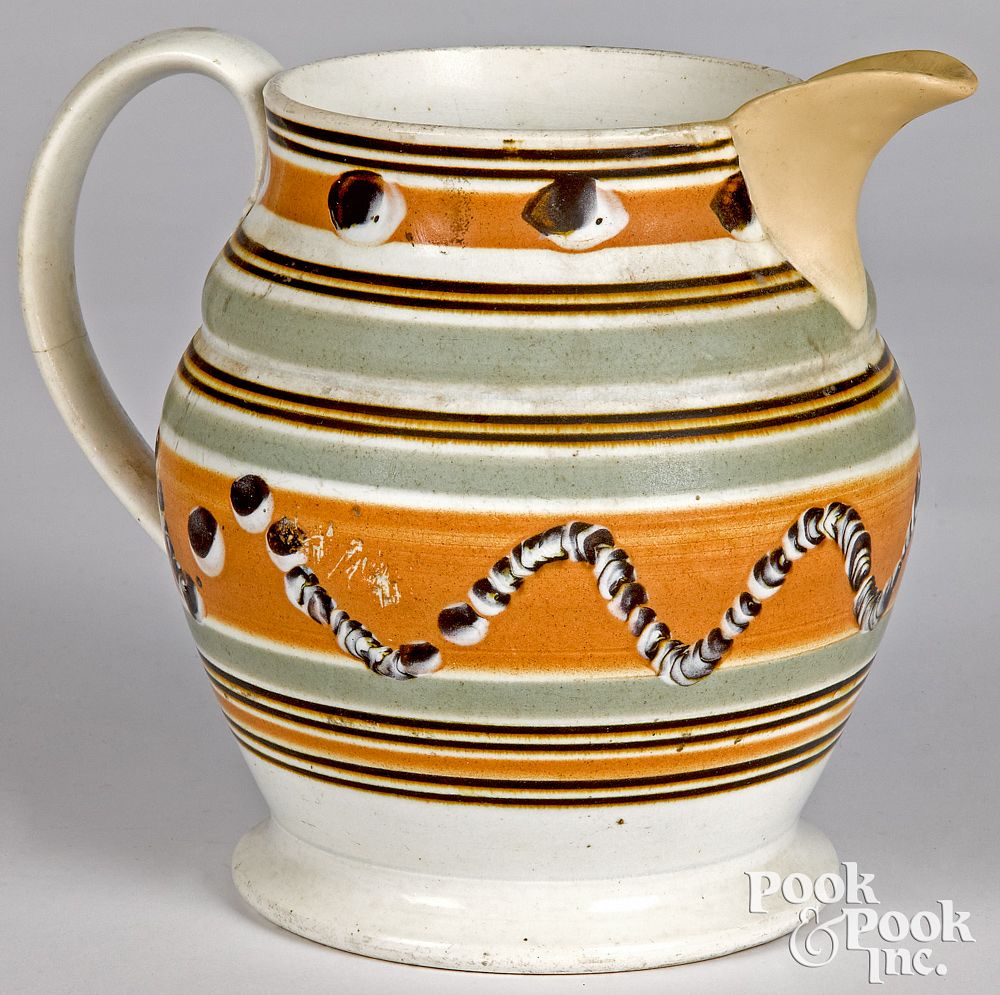 Appraisal: Mocha pitcher Mocha pitcher with cat's-eye and earthworm decoration h