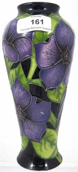 Appraisal: Moorcroft Trial Vase decorated with Purple Green Scottish Flowers dated