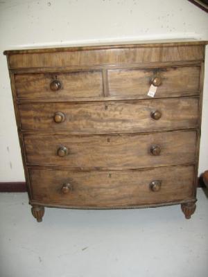 Appraisal: A MAHOGANY CHEST early th century of bowed form moulded