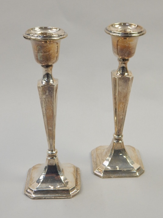 Appraisal: A pair of George V silver candlesticks of tapering form