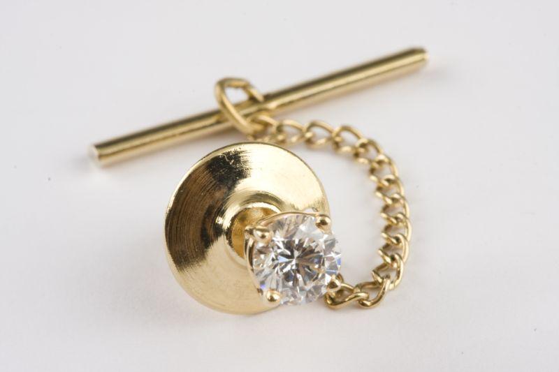 Appraisal: KT Gold and Diamond Tie Tack containing one round brilliant