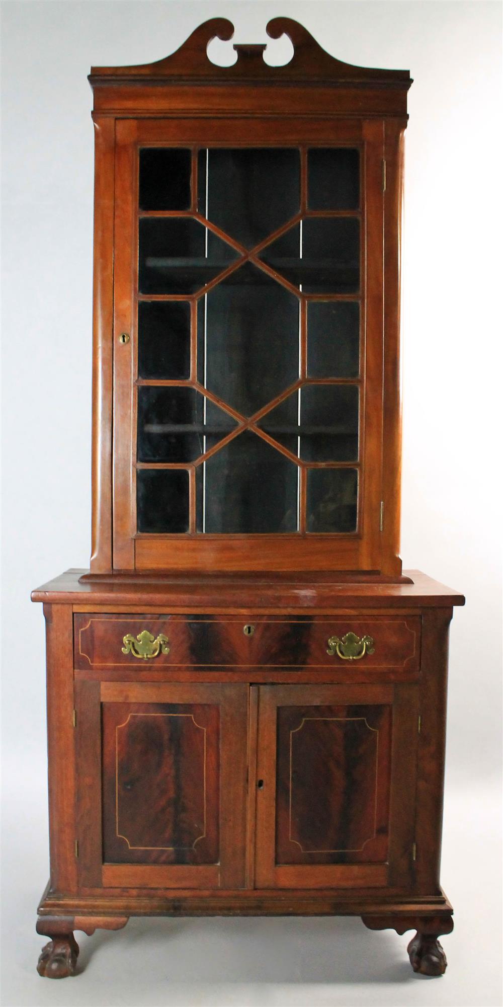 Appraisal: TRANSITIONAL REVIVAL MAHOGANY BOOKCASE The upper section of Chippendale form