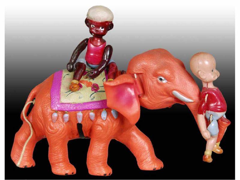 Appraisal: Celluloid Henry on Elephant Toy Description '' L Celluloid Wind-up