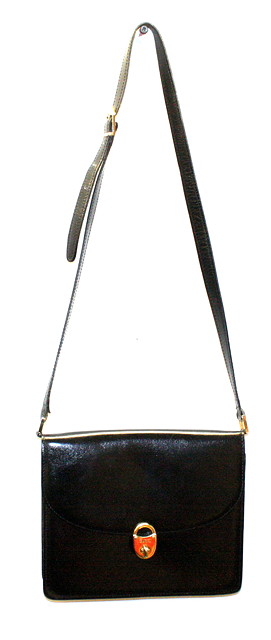 Appraisal: A BLACK 'GUCCI' SHOULDER BAG with gold coloured clasp in