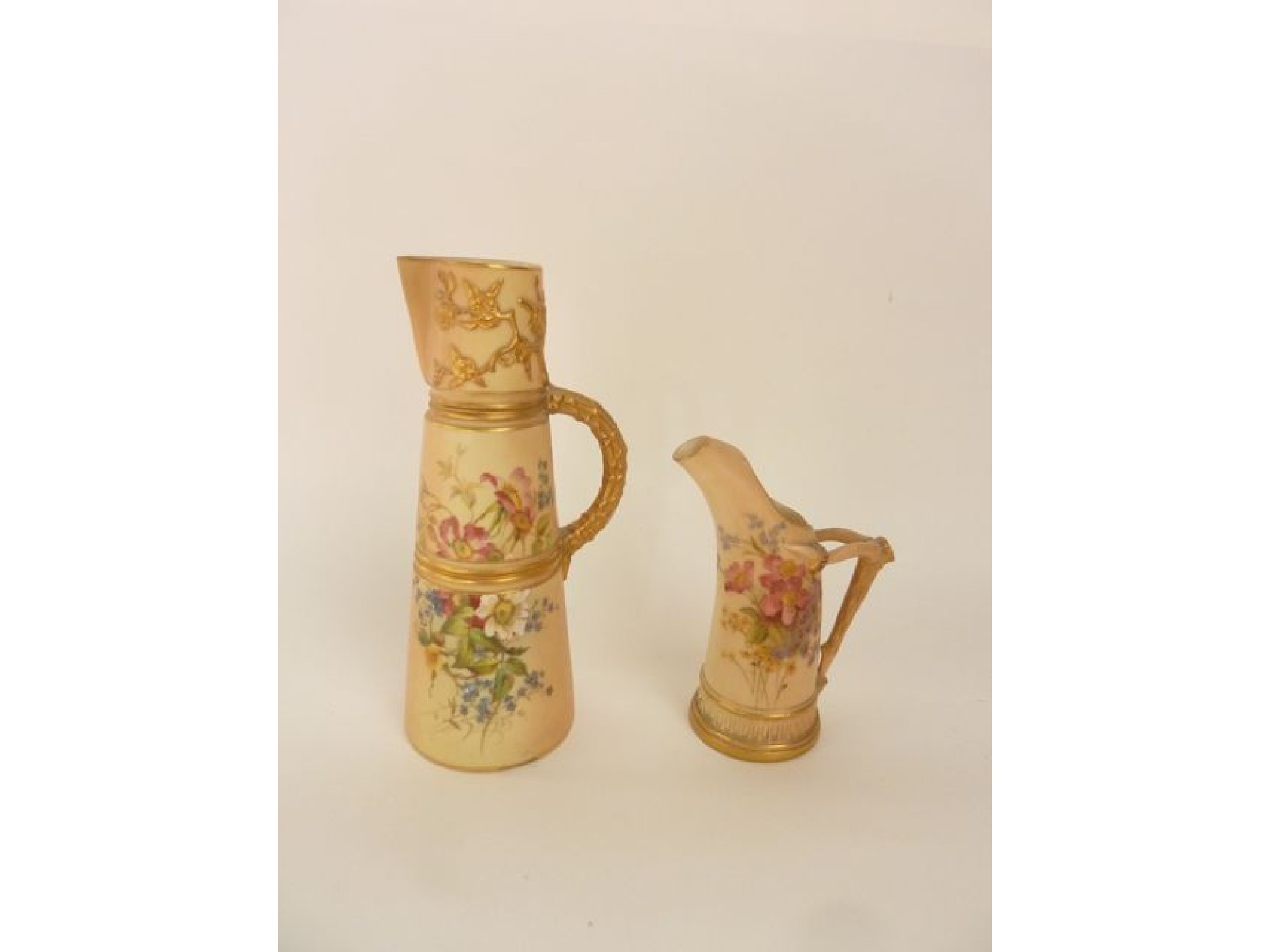 Appraisal: A Royal Worcester blush ivory jug of tapering cylindrical form