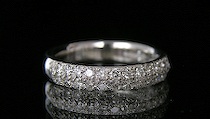 Appraisal: A Platinum and Pave Diamond Band A very pretty platinum