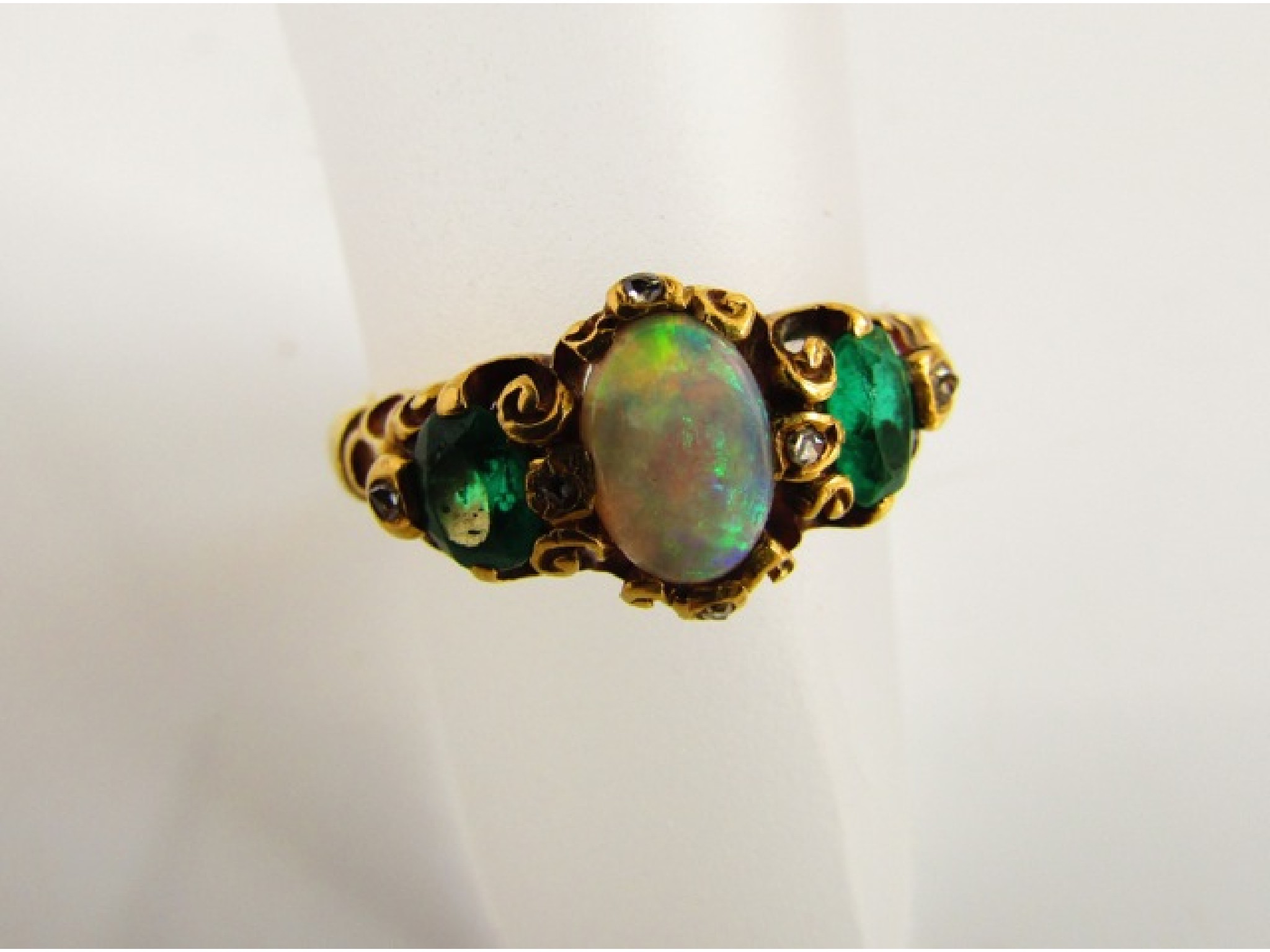 Appraisal: A Victorian style opal emerald and diamond ring centred with