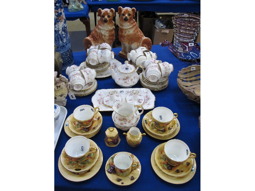 Appraisal: Four Aynsley fruit decorated teacups saucers and plates small vase