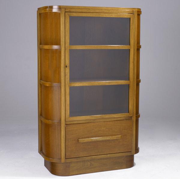 Appraisal: DONALD DESKEY Walnut bookcase with locking glass door enclosing three