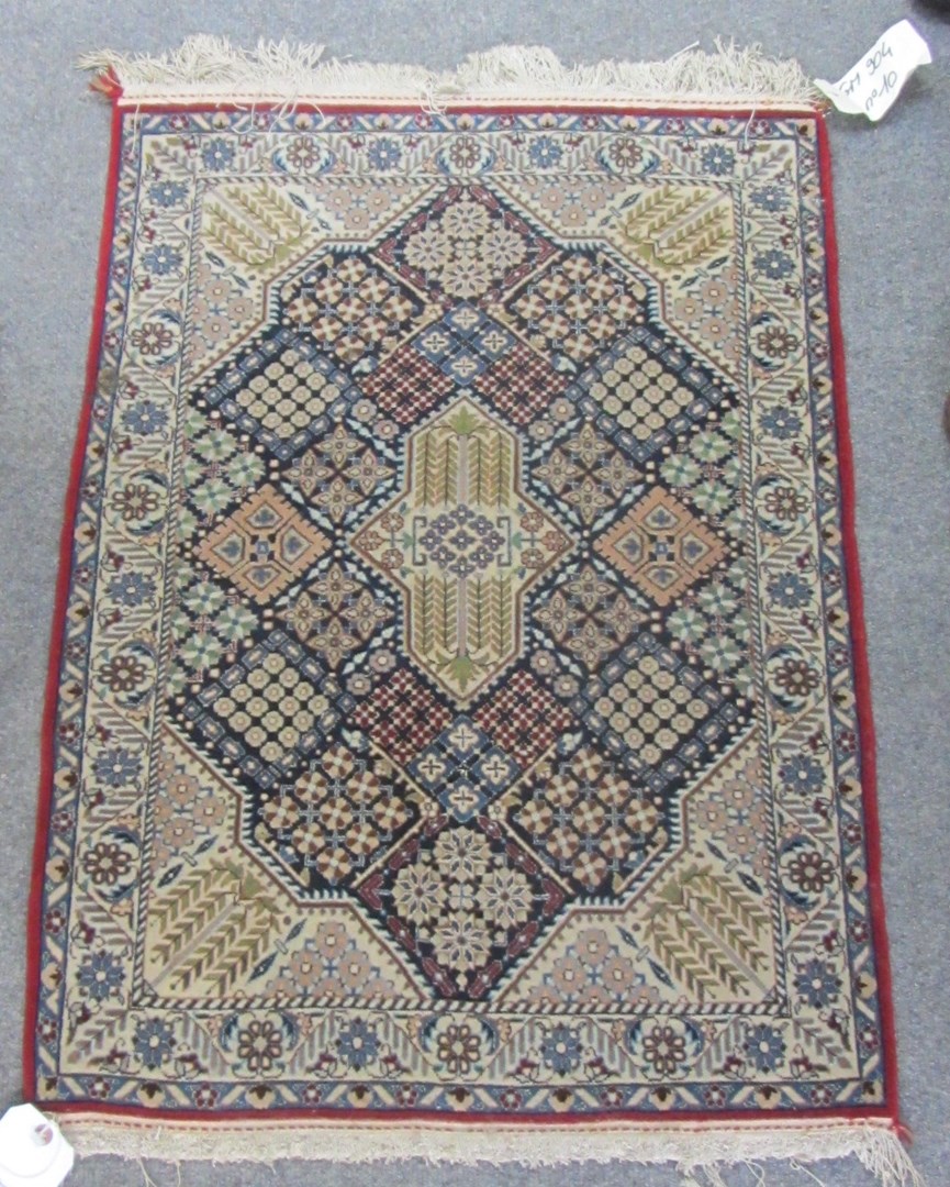 Appraisal: An Esfahan mat Persian the tiled field with central medallion