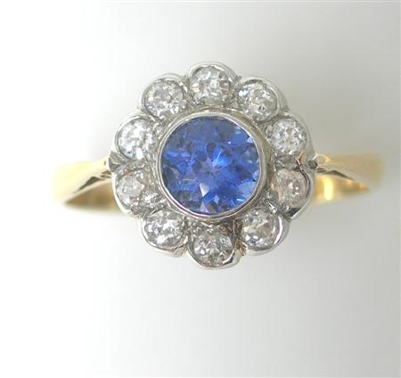 Appraisal: A sapphire and diamond floral cluster ring collet set to