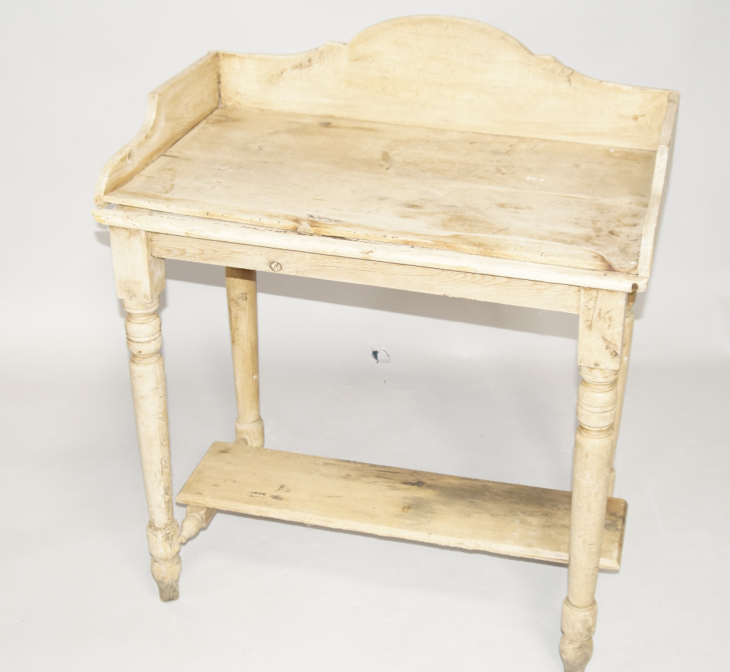 Appraisal: A Victorian pine washstand with gallery back and undershelf on