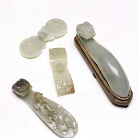 Appraisal: FOUR ANTIQUE JADE BELT BUCKLES Four antique Chinese carved jade