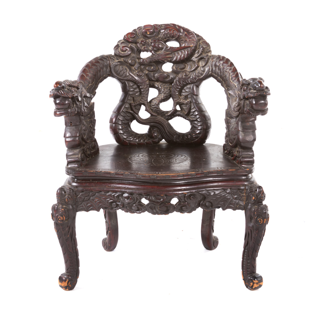 Appraisal: Chinese carved hardwood dragon armchair early th century scrolled dragon