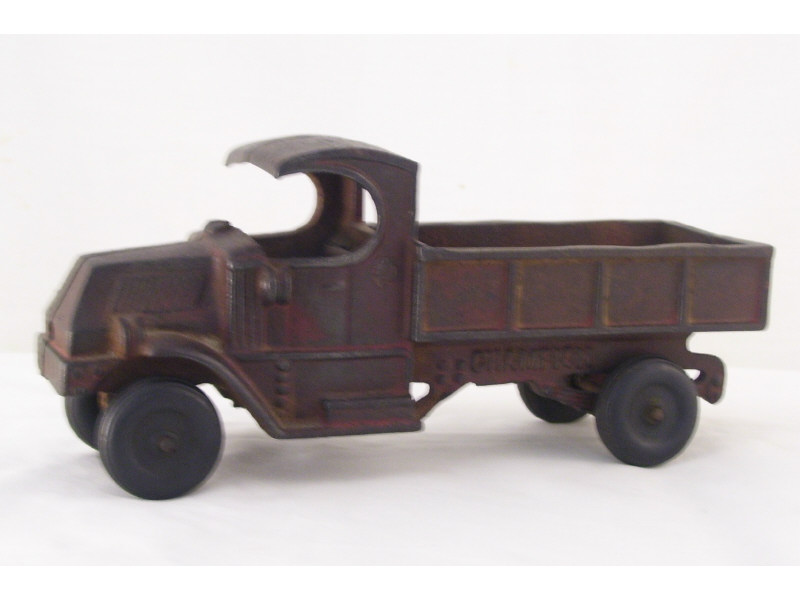 Appraisal: Cast Iron Low Bed Truck Faded original red paint with