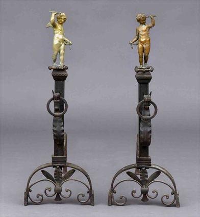 Appraisal: PAIR OF RENAISSANCE-STYLE WROUGHT IRON AND GILT-METAL FIRE DOGS Each