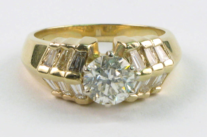 Appraisal: DIAMOND AND FOURTEEN KARAT GOLD RING featuring around brilliant-cut diamond