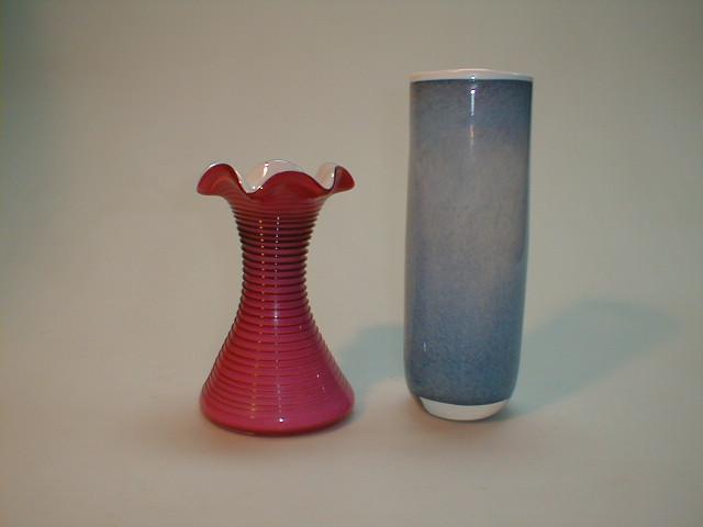 Appraisal: A cranberry and white cased glass vase with spiral thread