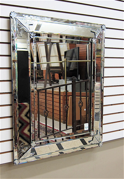 Appraisal: A VENETIAN STYLE RECTANGULAR WALL MIRROR double beveled having an